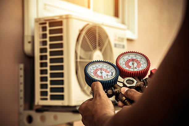 Professional Air Conditioning Service technician working in Manhattan, KS
